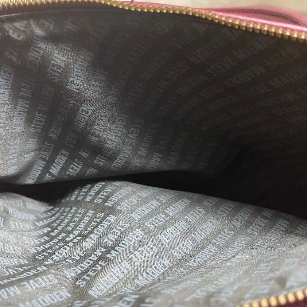 Steve Madden burgundy faux leather satchel with rustic studs accent.